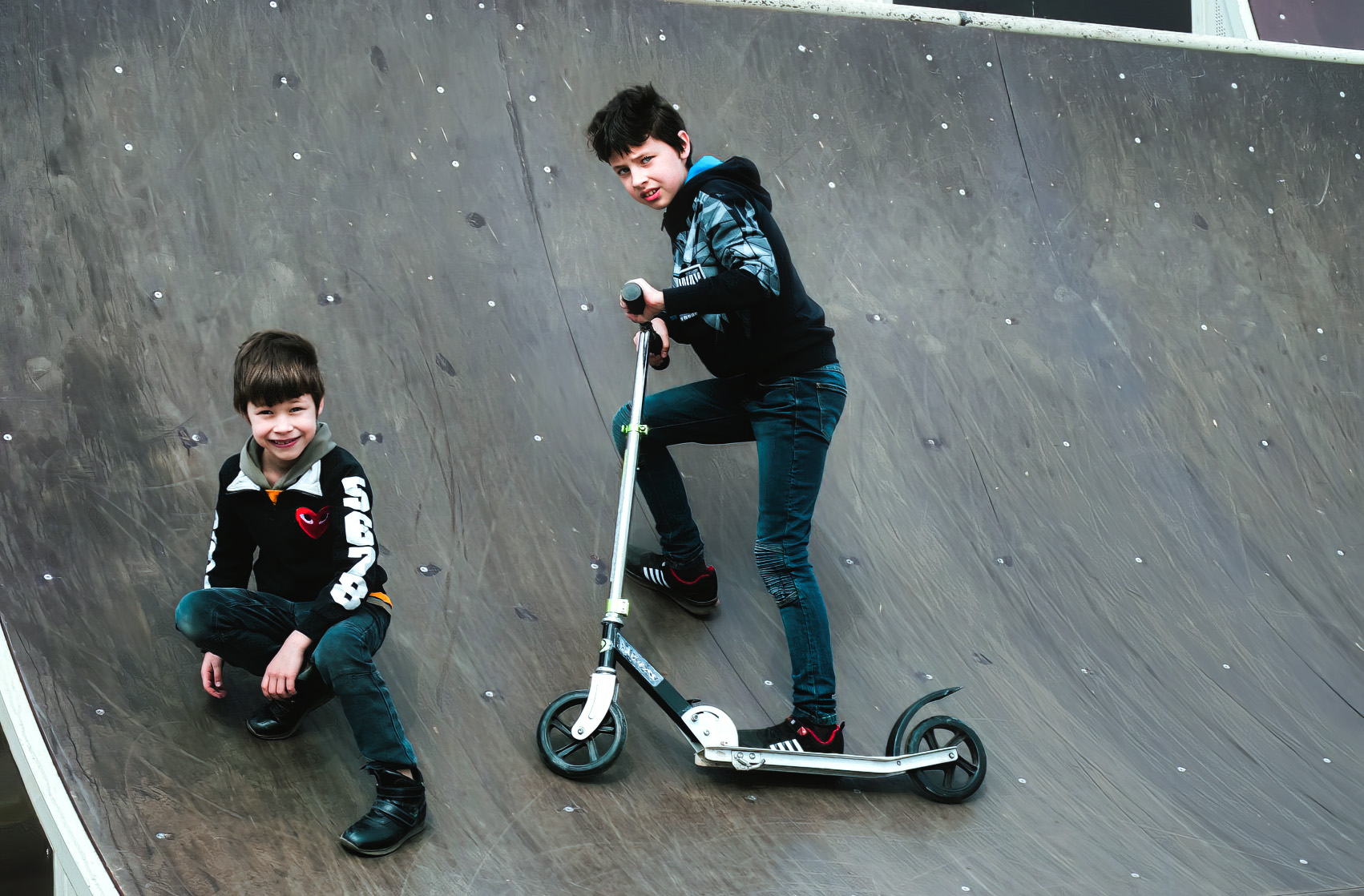 Watch out, world - these kids are tearing up the stunt scooter circuit! (Photo: Unsplash)